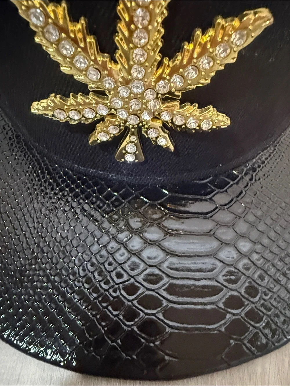 Black Men's Snapback Hat with Gold Leaf Embellishment